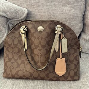 COACH Peyton Signature Monogram Coated
Canvas w/ crossbody strap